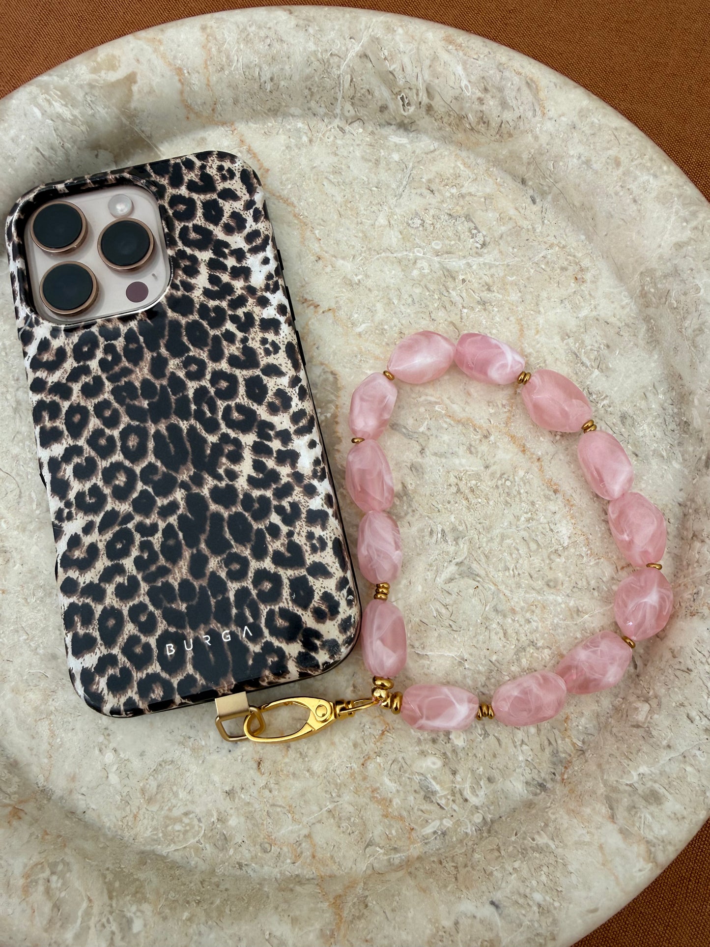 Bracelet de téléphone rose pâle